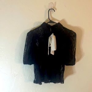 Black lacy top with a white pussycat bow